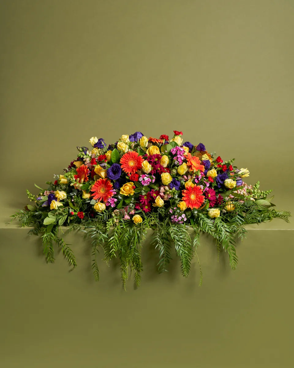 Premium Bright Casket Flower Arrangement