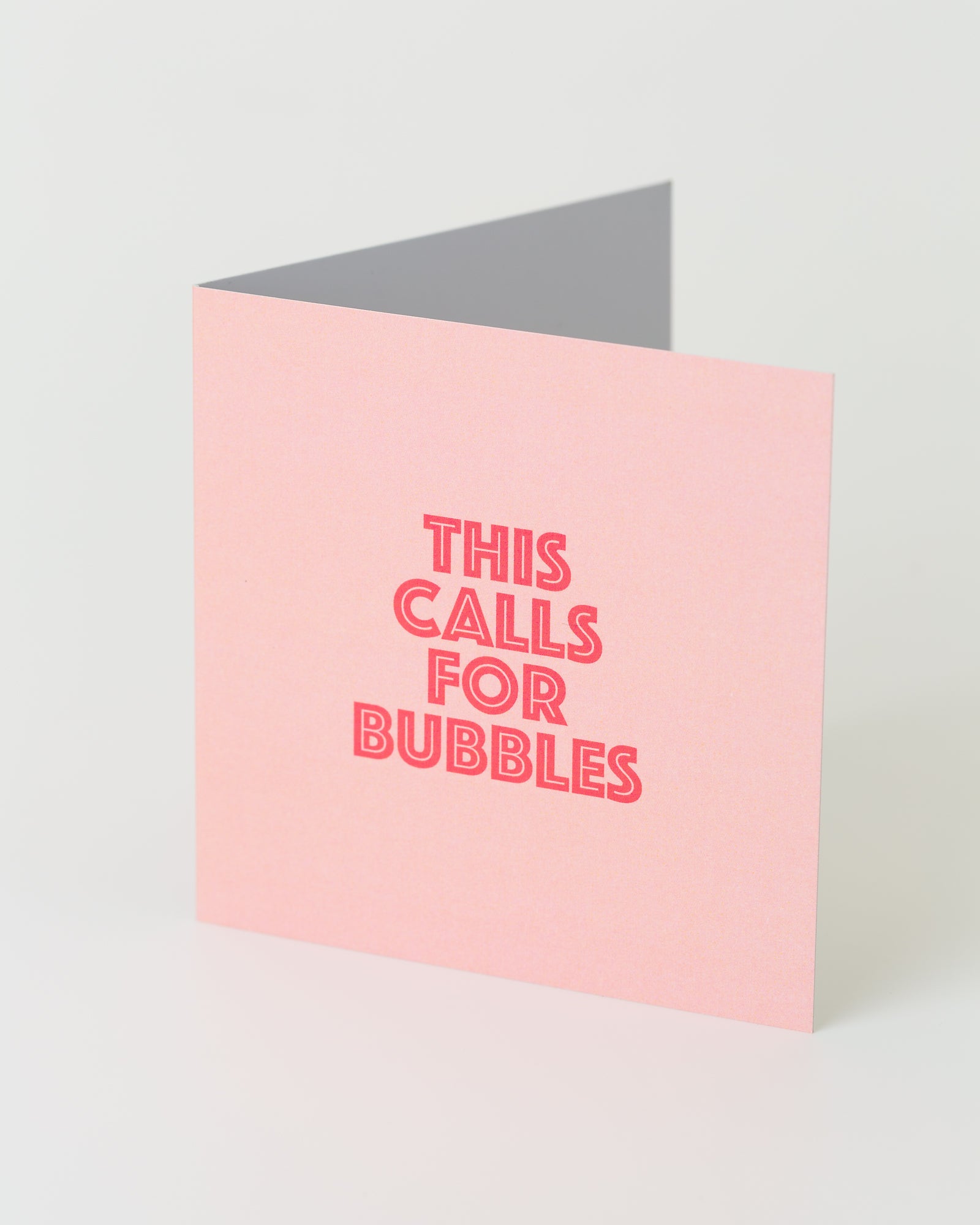 'This calls for bubbles' greeting card